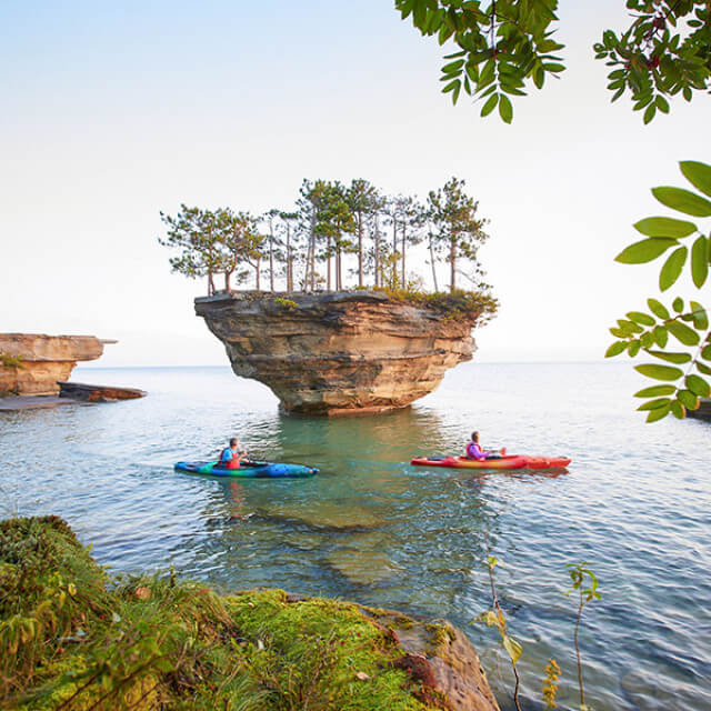 Kayaking near Lake Huron's Turnip Rock off the coast of Port Austin, Michigan
