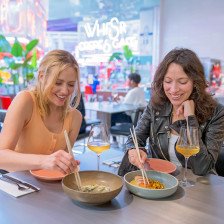 Sharing a meal at the POST Houston food hall in Houston, Texas